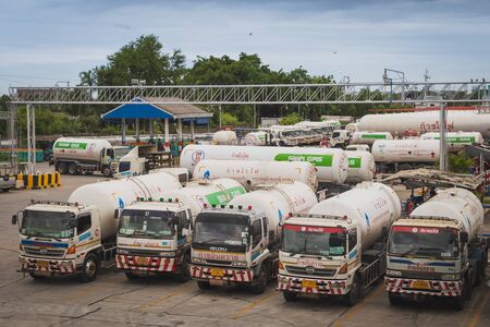 Bangkok, Thailand - July 4, 2019: Liquefied petroleum gas (LPG) tanker trucks in Sathupradit terminal of Siam Gas Company, which are delivered to customers nationwide.のeditorial素材