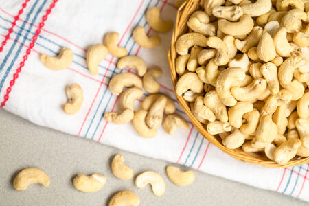 Raw cashew nuts in a rattan basket