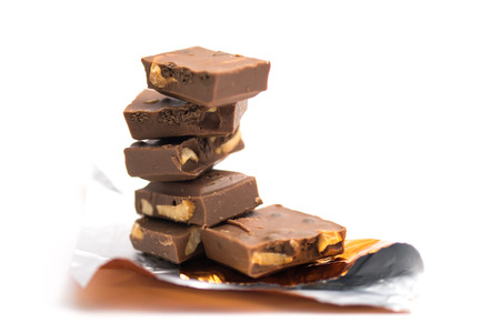 Group of cookie and nut chocolate on isolated white backgroundの写真素材