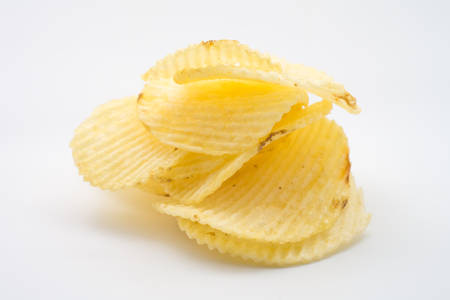 Group of potato chips in bag on white backgroundの写真素材