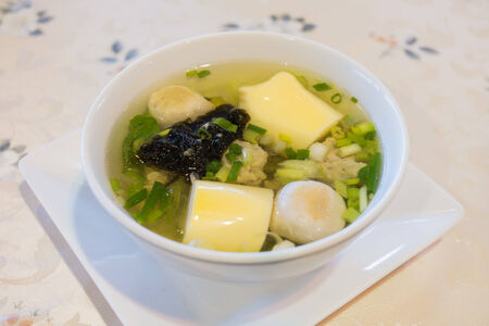Pork balls soup with tofu seaweet and fish ballsの写真素材
