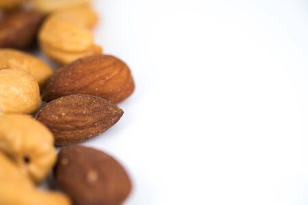 Almonds and cashew nuts on white backgroundの写真素材