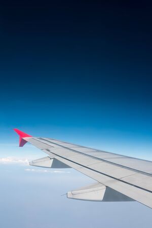 Wing of airplane from windowの写真素材