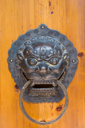 Chinese door holder, old style in Feng Huang, the most famous ancient town in Hunan province, China.の写真素材