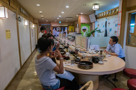 FUKUOKA, JAPAN - SEPTEMBER 26, 2014: Interior of japanese sushi restaurant on Tenjin street in Fukuoka, Japan.のeditorial素材