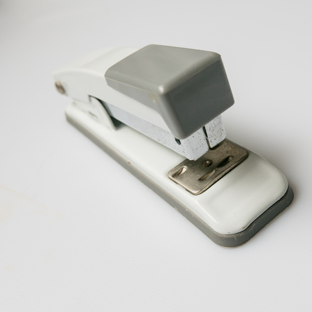 Grey-white  Stapler on white background.の写真素材