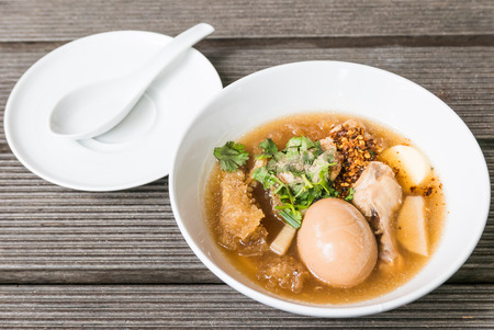 Fish maw soup on wooden backgroundの写真素材