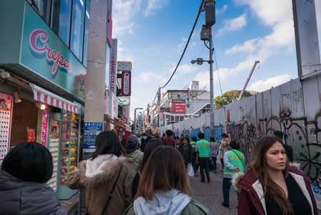 TOKYO, JAPAN - NOVEMBER 30,  2015: Takeshita Street is a pedestrian-only street lined with fashion boutiques, cafes and restaurants in Harajuku in Tokyo, Japan.のeditorial素材