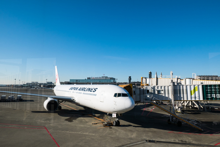 TOKYO, JAPAN - DECEMBER 5, 2015 Airplane near the terminal in an airportin the morning, Narita international airportのeditorial素材