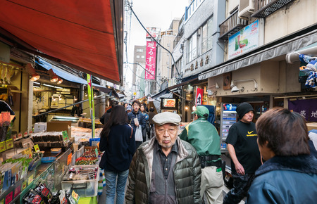 Tokyo, Japan - November 30, 2015: A small area of Tsukiji fish market, The Tsukiji Market, supervised by the Tokyo Metropolitan Central Wholesale Market of the Tokyo Metropolitan Bureau of Industrial and Labor Affairs, is the biggest wholesale fish and seのeditorial素材