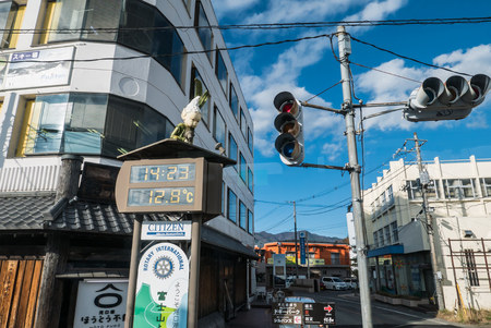 KAWAGUCHIKO, JAPAN - DECEMBER 1, 2015: Digital clock with temperature display in front of Kawaguchiko Station, Japanのeditorial素材
