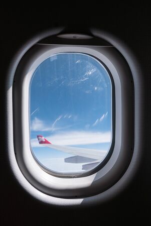 TOKYO, JAPAN - DECEMBER 5, 2015 Window of Airasia airplane in the morningのeditorial素材