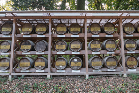 Tokyo, Japan - November 30, 2015: This picture shows sake barrels near the Meiji shrine in Tokyo. The sake barrels are given to the shrine as a sacrifice.のeditorial素材