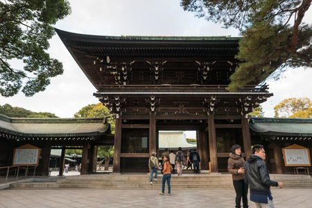 Tokyo, Japan - November 30, 2015: Several tourists visiting the centre of a famous shrine in Tokyo, Japan.のeditorial素材