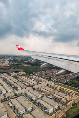 Bangkok, Thailand - DECEMBER 5, 2015 Window of Airasia airplane in the afternoon landing at Donmuang airport, Bangkok, Thailandのeditorial素材