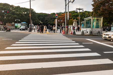 Tokyo, Japan - November 30, 2015: Cross road to Harajuku station in the afternoon on November 30, 2015. Harajuku is known as a center of Japanese youth culture and fashion and shopping.のeditorial素材