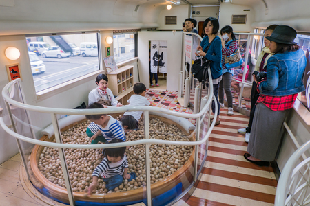KUMAMOTO, JAPAN - SEPTEMBER 27, 2014: Interior of special train Asoboy running between Kumamoto and Aso. The Aso Boy  is a limited express train service in Kyushu, Japan, operated by Kyushu Railway Company (JR Kyushu) since June 2011. The train normally rのeditorial素材