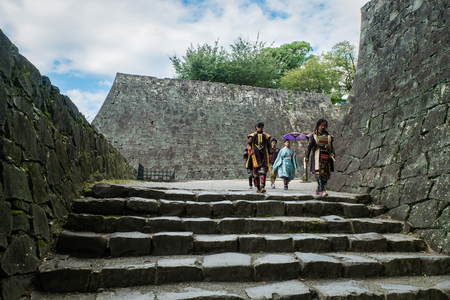 KUMAMOTO, JAPAN - SEPTEMBER 27, 2014: People dressed as ancient Samurai at Kumamoto castle in Kumamoto, Japan. Kumamoto Castle is a hilltop Japanese castle located in ChÅ«Å-ku, Kumamoto in Kumamoto Prefecture. It was a large and extremely well fortified のeditorial素材
