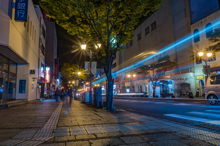KUMAMOTO, JAPAN - SEPTEMBER 27, 2014: Slow speed shutter og the street near Beppu station at night in Fukuoka, Japan.のeditorial素材