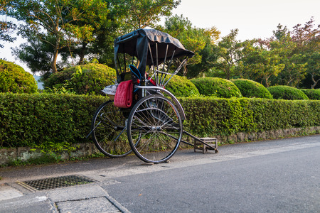 Yufuin, Japan - September 28, 2014: Japanese rickshaw on the street in Yufuin, Japan. Yufuin was a town located in Oita District, Oita Prefecture, Japan. Yufuin is now a district within the city of Yufu.のeditorial素材