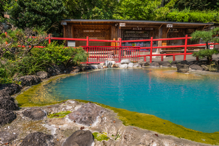 Beppu, Japan - September 28, 2014: Kamado Jigoku
or cooking pot hell in Beppu, Oita, Japan. Features several boiling ponds and a flashy demon statue as cook. On the grounds, visitors can drink the hot spring water, enjoy hand and foot baths, inhale the ho