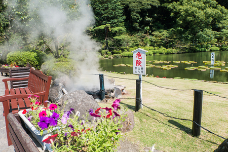 Beppu, Japan - September 28, 2014: Garden in Umi Jigoku or Sea hell in Beppu, Oita, Japan is one of the most beautiful hells, the "sea hell" features a pond of boiling, blue water. In its spacious gardens, there are a few secondary, orange colored hells aのeditorial素材