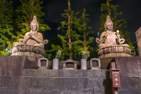 Tokyo, Japan - April 30, 2016: Seated Buddhas at Senso-ji Red Japanese Temple at night in Asakusa, Tokyo, Japanのeditorial素材
