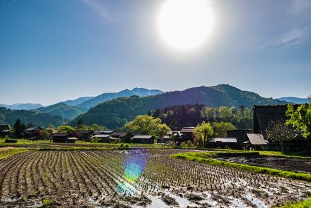 Shirakawa-go, Japan - May 2, 2016: Historical village of Shirakawa-go with sun flare. Shirakawa-go is one of Japan's UNESCO World Heritage Sites located in Gifu Prefecture, Japan.のeditorial素材