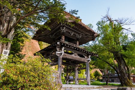 Shirakawa-go, Japan - May 2, 2016: Bell tower at the temple in Shirakawa-go. Shirakawa-go is one of Japan's UNESCO World Heritage Sites located in Gifu Prefecture, Japan.のeditorial素材