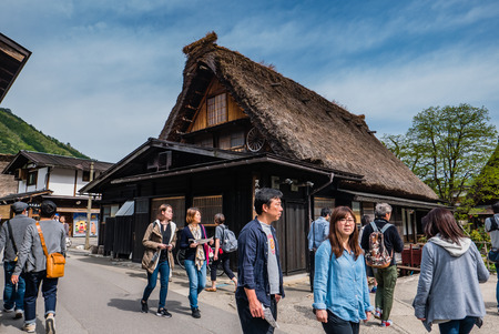 Shirakawa-go, Japan - May 3, 2016: Tourists visiting Shirakawa-go. Shirakawa-go is one of Japan's UNESCO World Heritage Sites located in Gifu Prefecture, Japan.のeditorial素材