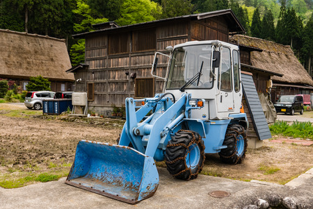 Shirakawa-go, Japan - May 3, 2016: Front end loader in Shirakawa-go in Shirakawa-go. Shirakawa-go is one of Japan's UNESCO World Heritage Sites located in Gifu Prefecture, Japan.のeditorial素材