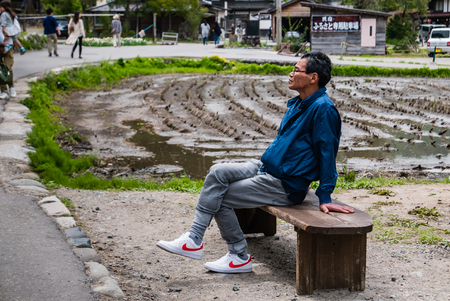 Shirakawa-go, Japan - May 3, 2016: Tourists visiting Shirakawa-go. Shirakawa-go is one of Japan's UNESCO World Heritage Sites located in Gifu Prefecture, Japan.のeditorial素材