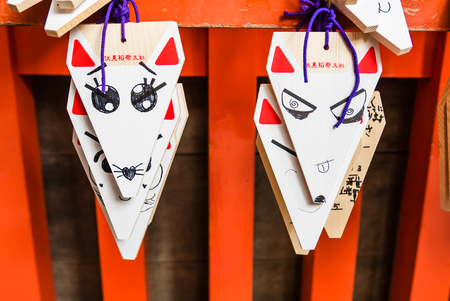 Kyoto, Japan - May 4, 2016: Fox Shape Ema (small wooden wishing plaques) at Fushimi Inari shrine. Fushimi Inari Taisha is the head shrine of Inari, located in Fushimi-ku, Kyoto, Japan.のeditorial素材