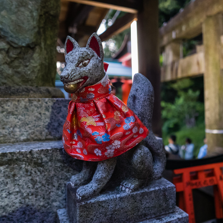 Kyoto, Japan - May 4, 2016: Fox sculpture in Fushimi Inari-taisha shrine. Fushimi Inari Taisha is the head shrine of Inari, located in Fushimi-ku, Kyoto, Japan.のeditorial素材