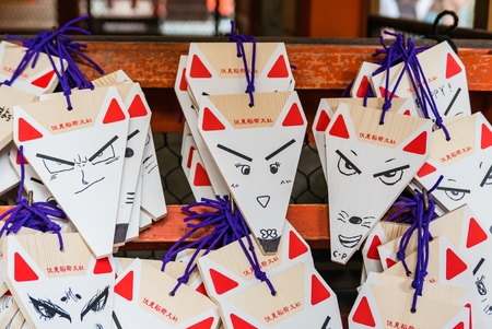 Kyoto, Japan - May 4, 2016: Fox Shape Ema (small wooden wishing plaques) at Fushimi Inari shrine. Fushimi Inari Taisha is the head shrine of Inari, located in Fushimi-ku, Kyoto, Japan.のeditorial素材