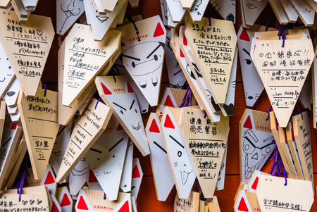 Kyoto, Japan - May 4, 2016: Fox Shape Ema (small wooden wishing plaques) at Fushimi Inari shrine. Fushimi Inari Taisha is the head shrine of Inari, located in Fushimi-ku, Kyoto, Japan.のeditorial素材