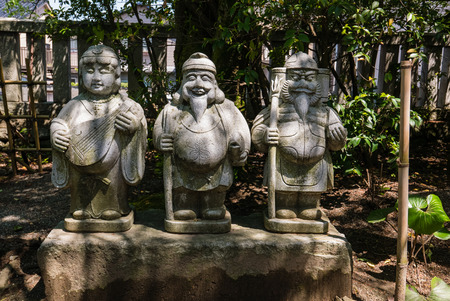 Kanazawa, Japan - May 4, 2016: God statues at Utasu Jinja Shrine near Higashi Chaya District (East Geisha District) in Kanazawa, Ishikawa Prefecture, Japan. This shrine is on the way from the Higashi Chaya District to the temple area on Utatsuyama Hill.のeditorial素材