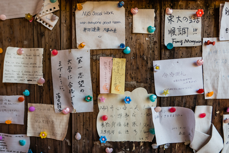 Kyoto, Japan - May 4, 2016: Wishing notes on wooden board at Fushimi Inari Shrine. Fushimi Inari Taisha is the head shrine of Inari, located in Fushimi-ku, Kyoto, Japan.のeditorial素材