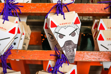Kyoto, Japan - May 4, 2016: Fox Shape Ema (small wooden wishing plaques) at Fushimi Inari shrine. Fushimi Inari Taisha is the head shrine of Inari, located in Fushimi-ku, Kyoto, Japan.のeditorial素材