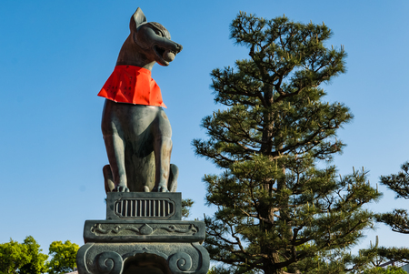 Kyoto, Japan - May 4, 2016: Fox sculpture in Fushimi Inari-taisha shrine. Fushimi Inari Taisha is the head shrine of Inari, located in Fushimi-ku, Kyoto, Japan.のeditorial素材
