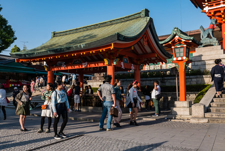 Kyoto, Japan - May 4, 2016: Tourists visiting Fushimi Inari shrine. Fushimi Inari Taisha is the head shrine of Inari, located in Fushimi-ku, Kyoto, Japan.のeditorial素材