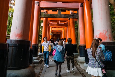 Kyoto, Japan - May 4, 2016: Tourists visiting Fushimi Inari shrine. Fushimi Inari Taisha is the head shrine of Inari, located in Fushimi-ku, Kyoto, Japan.のeditorial素材