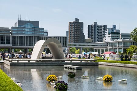 Hiroshima, Japan - May 5, 2016: The Memorial Cenotaph at Hiroshima Peace Memorial park. Hiroshima Peace Memorial Park  is a memorial park in the center of Hiroshima, Japan. It is dedicated to the legacy of Hiroshima as the first city in the world to suffeのeditorial素材