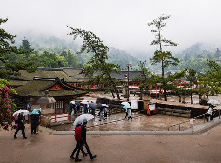 Miyajima, Japan - May 6, 2016: Tourist visit Itsukushima Shrine on Miyajima Island.  Miyajima island is a famous island shrine-town is a UNESCO World Heritage Site and a major tourism destination.のeditorial素材