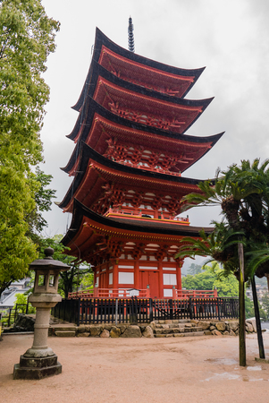 Miyajima, Japan - May 6, 2016: Five-storied Pagoda (Gojunoto) on Miyajima Island.  Miyajima island is a famous island shrine-town is a UNESCO World Heritage Site and a major tourism destination.のeditorial素材