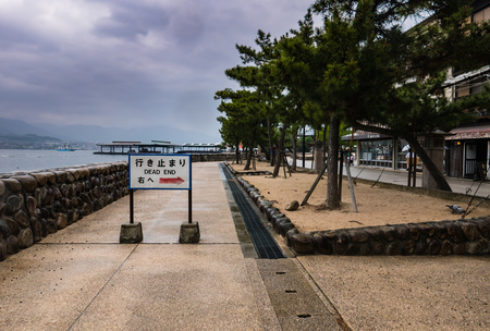 Miyajima, Japan - May 6, 2016: Dead end sign on Miyajima island, Famous island shrine-town is a UNESCO World Heritage Site and a major tourism destination.のeditorial素材