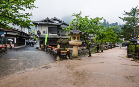 Miyajima, Japan - May 6, 2016: Town of Itsukushima floating Torii Gate in Miyajima. Miyajima island is a famous island shrine-town is a UNESCO World Heritage Site and a major tourism destination.のeditorial素材