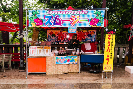 Miyajima, Japan - May 6, 2016: Street food vendor on Miyajima island. Miyajima island is a famous island shrine-town is a UNESCO World Heritage Site and a major tourism destination.のeditorial素材