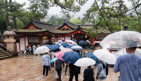 Miyajima, Japan - May 6, 2016: Tourist visit Itsukushima Shrine on Miyajima Island.  Miyajima island is a famous island shrine-town is a UNESCO World Heritage Site and a major tourism destination.