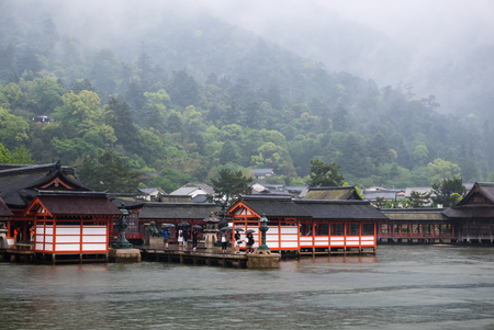 Miyajima, Japan - May 6, 2016: Tourist visit Itsukushima Shrine on Miyajima Island.  Miyajima island is a famous island shrine-town is a UNESCO World Heritage Site and a major tourism destination.のeditorial素材